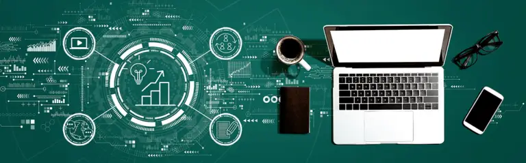 Laptop with SEO growth graphics, coffee cup, notebook, and smartphone on a green background, illustrating digital marketing and search engine optimization strategies.
